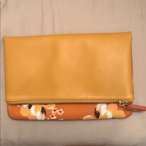 Leather clutch with floral detail. Brand new.